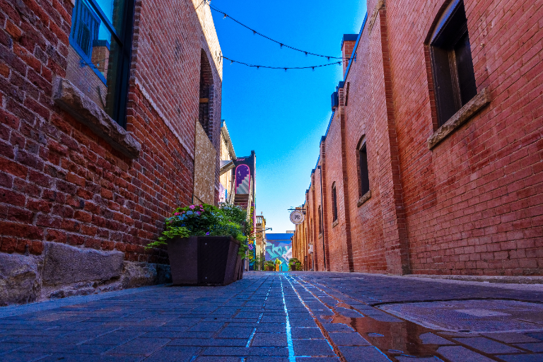 Brick alley in Old Town Fort Collins on a sunny morning